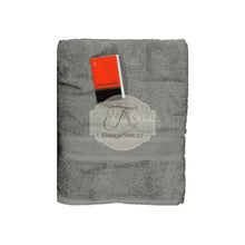 Carica l'immagine nel visualizzatore di Gallery, a piece of luggage sitting on top of a table