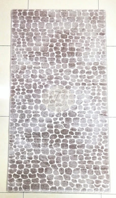 a black and white photo of a tiled wall 