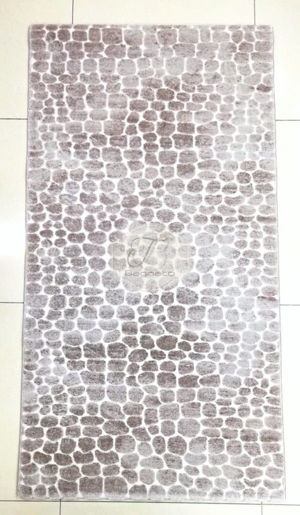 a black and white photo of a tiled wall 