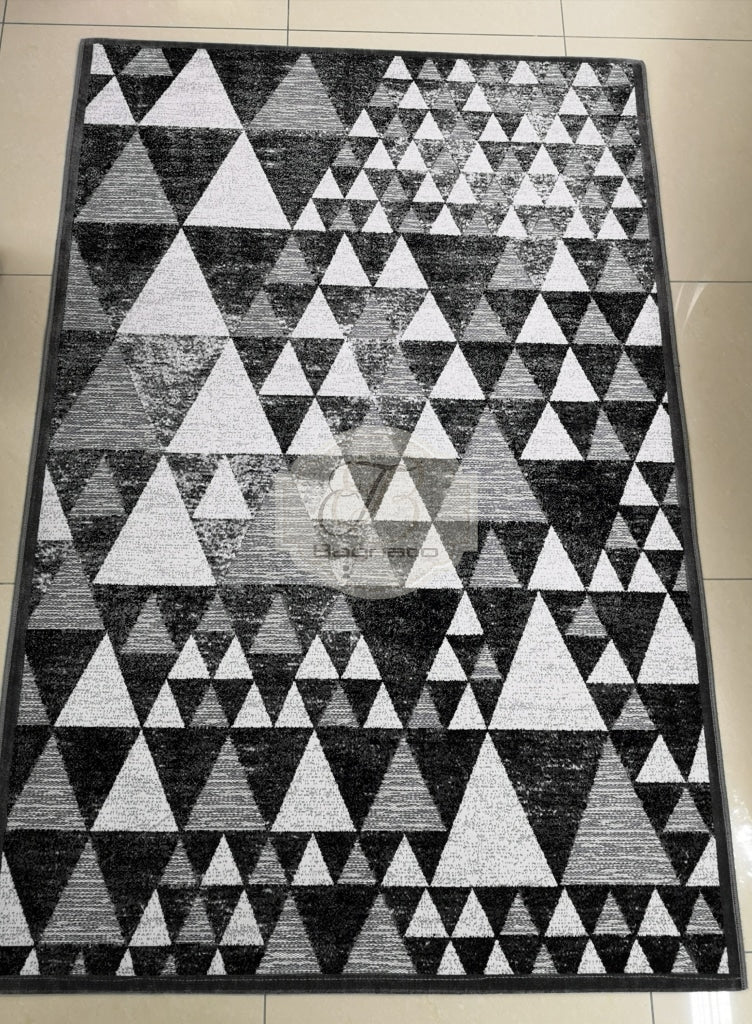 a black and white photo of a black and white checkered floor 